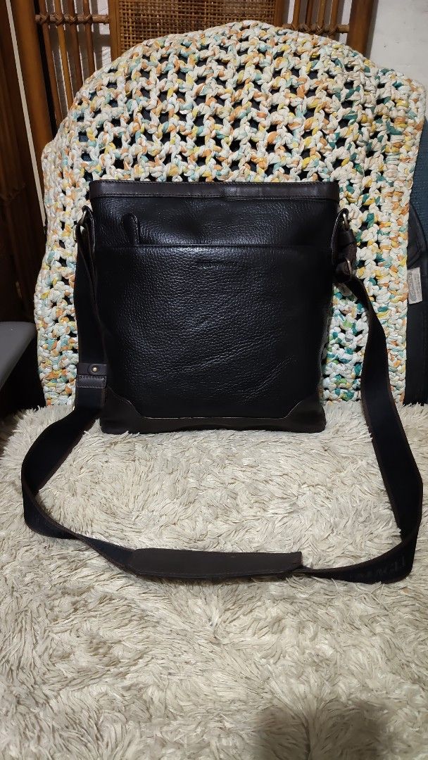 Black Leather Crossbody Bag (Category: Sling Bags) located in Cebu City. Submitted by lumaynojes00490 (Listing ID 1463956281, Image 1). Description: - Stylish black leather crossbody bag - Textured leather finish for a premium look - Elegant dark brown accents on top and bottom trim - Adjustable strap for comfortable wear - Spacious interior to hold all your essentials - Ideal for everyday use and versatile styling.