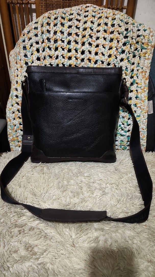 Black Leather Crossbody Bag (Category: Sling Bags) located in Cebu City. Submitted by lumaynojes00490 (Listing ID 1463956281, Image 2). Description: - Stylish black leather crossbody bag - Textured leather finish for a premium look - Elegant dark brown accents on top and bottom trim - Adjustable strap for comfortable wear - Spacious interior to hold all your essentials - Ideal for everyday use and versatile styling.