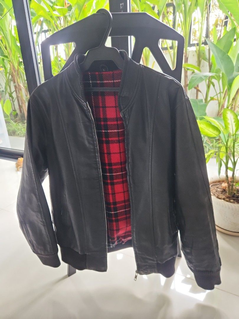 Genuine Leather Jacket (Category: Coats, Jackets and Outerwear) located in San Juan City. Submitted by rdlr5050 (Listing ID 1463967802, Image 2). Description: - genuine leather - Classic design - Warm red plaid lining - Ribbed cuffs and hem for a snug fit - bought in Japan and used lightly in one of our trips - kept in the closet for a while RFS: need more closet space as we are renovating. dont want to maintain leather jackets. selling almost al