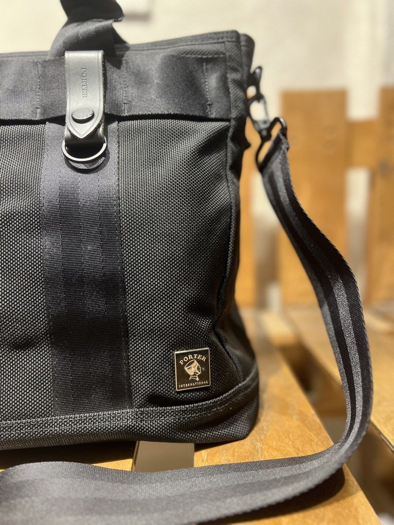 Black Porter Heat 2Way Tote Bag (Category: Sling Bags) located in Quezon City. Submitted by shanks. (Listing ID 1463940997, Image 2). Description: Black Porter Heat 2Way Tote Bag crafted from durable barrister nylon with a signature removable flashlight accessory on the front. Issue : missing maglite flash light Sign of wear in good condition .