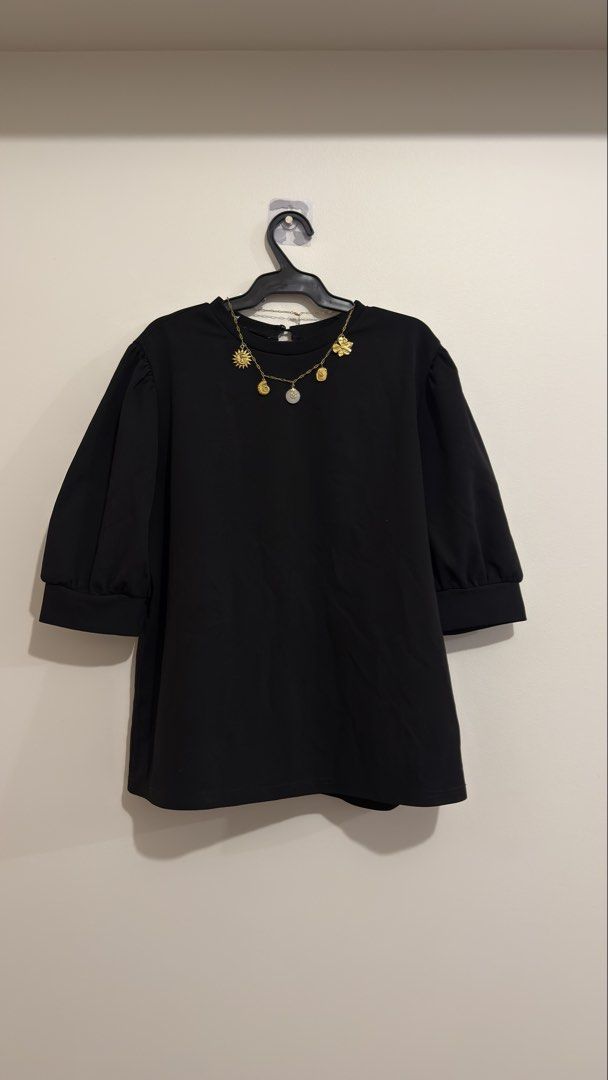 Black Puff Sleeve T-shirt (Category: Shirts) located in Makati City. Submitted by jessi_1004 (Listing ID 1463999110, Image 1). Description: - Chic black t-shirt with adorable puff sleeves. *accessory not included.