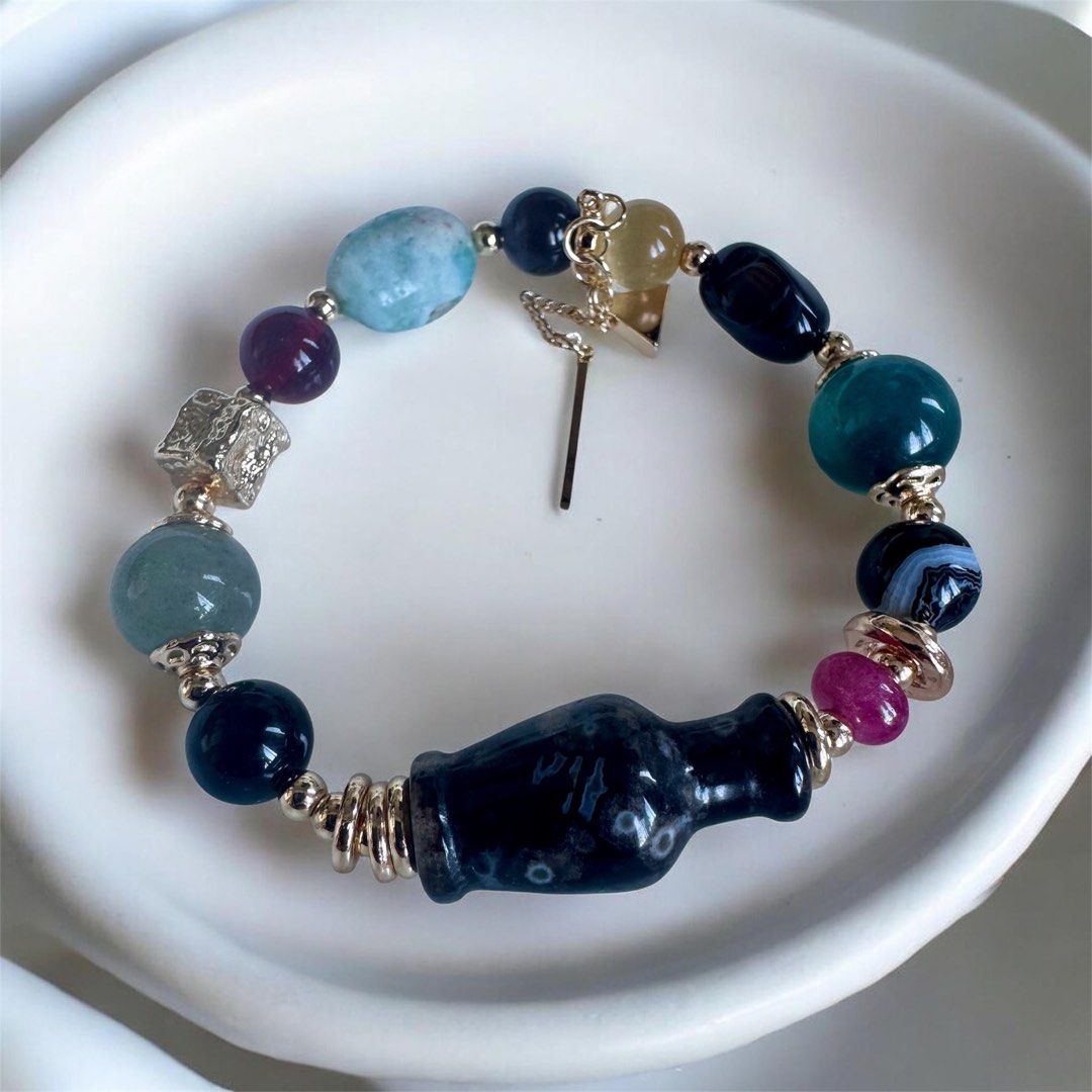 Black sakura protection stone bracelet (Category: Bracelets) located in Quezon City. Submitted by nics006 (Listing ID 1463938565, Image 2). Description: “Wear peace. Store your prosperity.” Black Sakura Agate & Cat Eye Bracelet with Lucky Treasure Vase — A wearable talisman for aura protection, mental clarity, and holding onto lifetime abundance. Emotional Healing & Renewal: Black Sakura Agate’s soft, blossom-like patterns foster inner peace, per