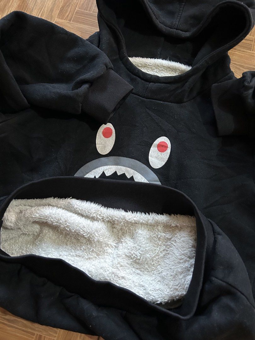 Black Shark Face Hoodie with Sherpa Lining (Category: Coats, Jackets and Outerwear) located in San Fernando. Submitted by erison.cruz26 (Listing ID 1463946292, Image 2). Description: - Black hoodie with a cool shark face graphic on the front. - Colorful text detail on one sleeve. - Tiger stripe design on the other sleeve. - Lined with super soft sherpa for extra warmth. - 5 to 7yrs old - Ideal for casual everyday wear..