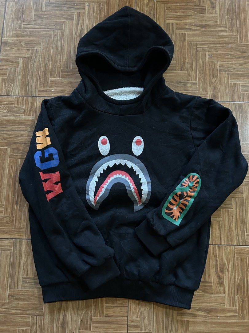 Black Shark Face Hoodie with Sherpa Lining (Category: Coats, Jackets and Outerwear) located in San Fernando. Submitted by erison.cruz26 (Listing ID 1463946292, Image 1). Description: - Black hoodie with a cool shark face graphic on the front. - Colorful text detail on one sleeve. - Tiger stripe design on the other sleeve. - Lined with super soft sherpa for extra warmth. - 5 to 7yrs old - Ideal for casual everyday wear..
