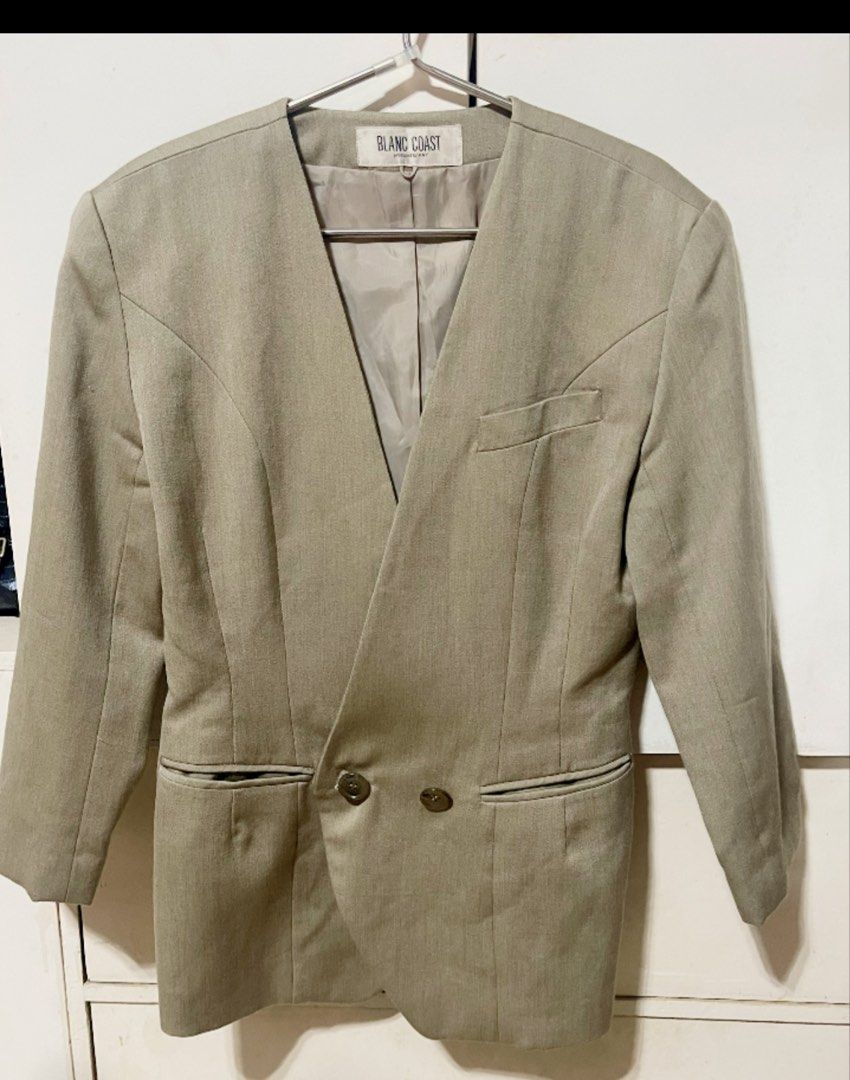 Blanc Coast Beige V-Neck Double-Breasted Blazer (Category: Coats, Jackets and Outerwear) located in Bulacan. Submitted by grazcloset (Listing ID 1464057753, Image 1). Description: - Beige blazer from Blanc Coast - V-neckline - Double-breasted button closure - Two front pockets - Chest pocket detail - Lined interior - Button details on cuffs - Ideal for smart casual or office wear Best Fit : M-L.