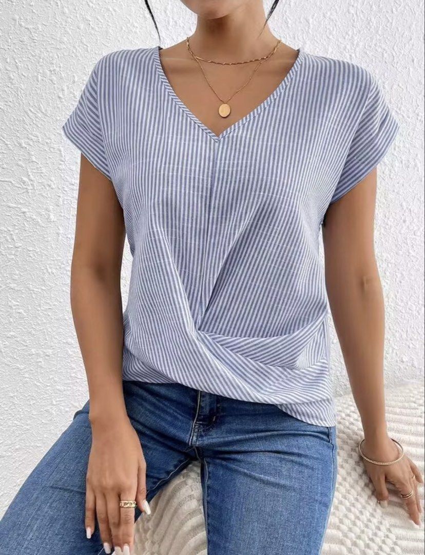 Blue and White Striped Twist Front V-Neck Top (Category: Blouses) located in Villasis. Submitted by juliaxgamboa (Listing ID 1463992907, Image 2). Description: - Casual blue and white striped top - Flattering twist front detail at the waist - V-neckline - Short sleeves - Versatile: pairs well with jeans or shorts - Comfortable and stylish for everyday wear - Easy to dress up or down.