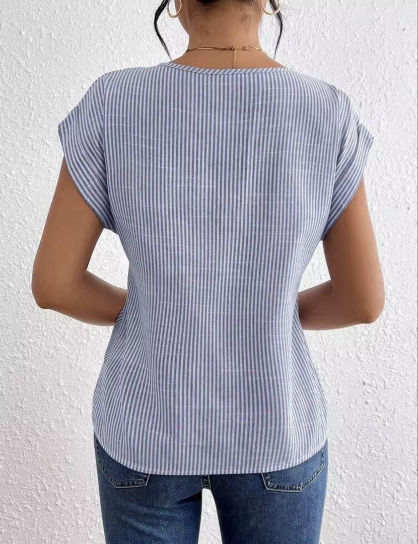 Blue and White Striped Twist Front V-Neck Top (Category: Blouses) located in Villasis. Submitted by juliaxgamboa (Listing ID 1463992907, Image 3). Description: - Casual blue and white striped top - Flattering twist front detail at the waist - V-neckline - Short sleeves - Versatile: pairs well with jeans or shorts - Comfortable and stylish for everyday wear - Easy to dress up or down.