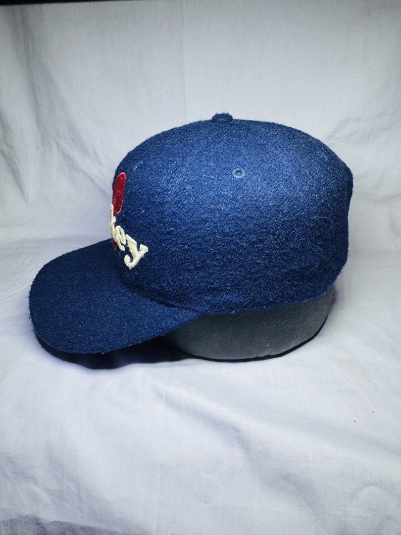 Blue Mickey Mouse Baseball Cap (Category: Caps & Hats) located in Roxas City. Submitted by patsquarephantz (Listing ID 1463991570, Image 3). Description: - Classic blue baseball cap - Features a red Mickey Mouse logo and 'Mickey' embroidery - Adjustable strap at the back for a custom fit - Fabric shows some texture - Perfect for casual wear and Disney enthusiasts - A fun addition to any outfit.