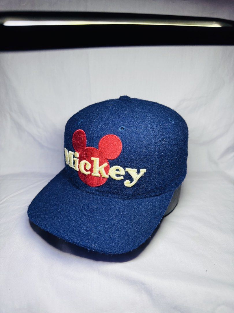Blue Mickey Mouse Baseball Cap (Category: Caps & Hats) located in Roxas City. Submitted by patsquarephantz (Listing ID 1463991570, Image 1). Description: - Classic blue baseball cap - Features a red Mickey Mouse logo and 'Mickey' embroidery - Adjustable strap at the back for a custom fit - Fabric shows some texture - Perfect for casual wear and Disney enthusiasts - A fun addition to any outfit.