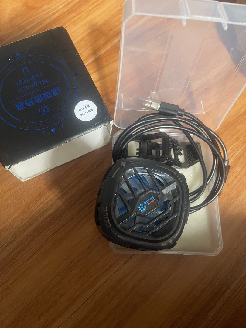 Blue wow x76 Phone Cooler Radiator (Category: Other Gadgets) located in Manila. Submitted by stephanie_ortiz (Listing ID 1463982714, Image 2). Description: -encluded clip for the cooler - Built-in fan with cool blue LED lights - Powered by included USB-C cable - Effectively prevents phone overheating - Compact and portable design.