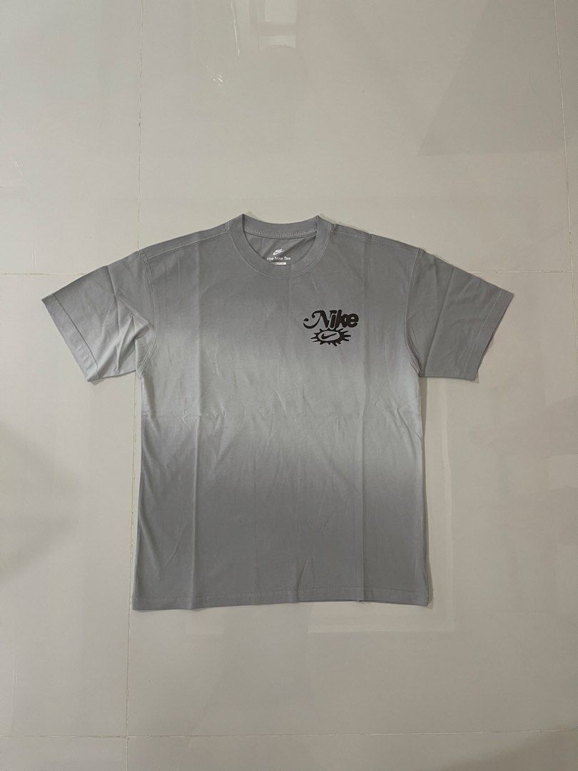 Bnew nike tees freeshippinv nationwide (Category: Tshirts & Polo Shirts ) located in Tarlac. Submitted by swoosh_garmentz (Listing ID 1464042477, Image 1). Description: - Grey Nike T-shirt - Features a 'Radiate the Sun' graphic print on the back - Small Nike logo on the front chest - Estimated size: Medium - Ideal for casual outfits.