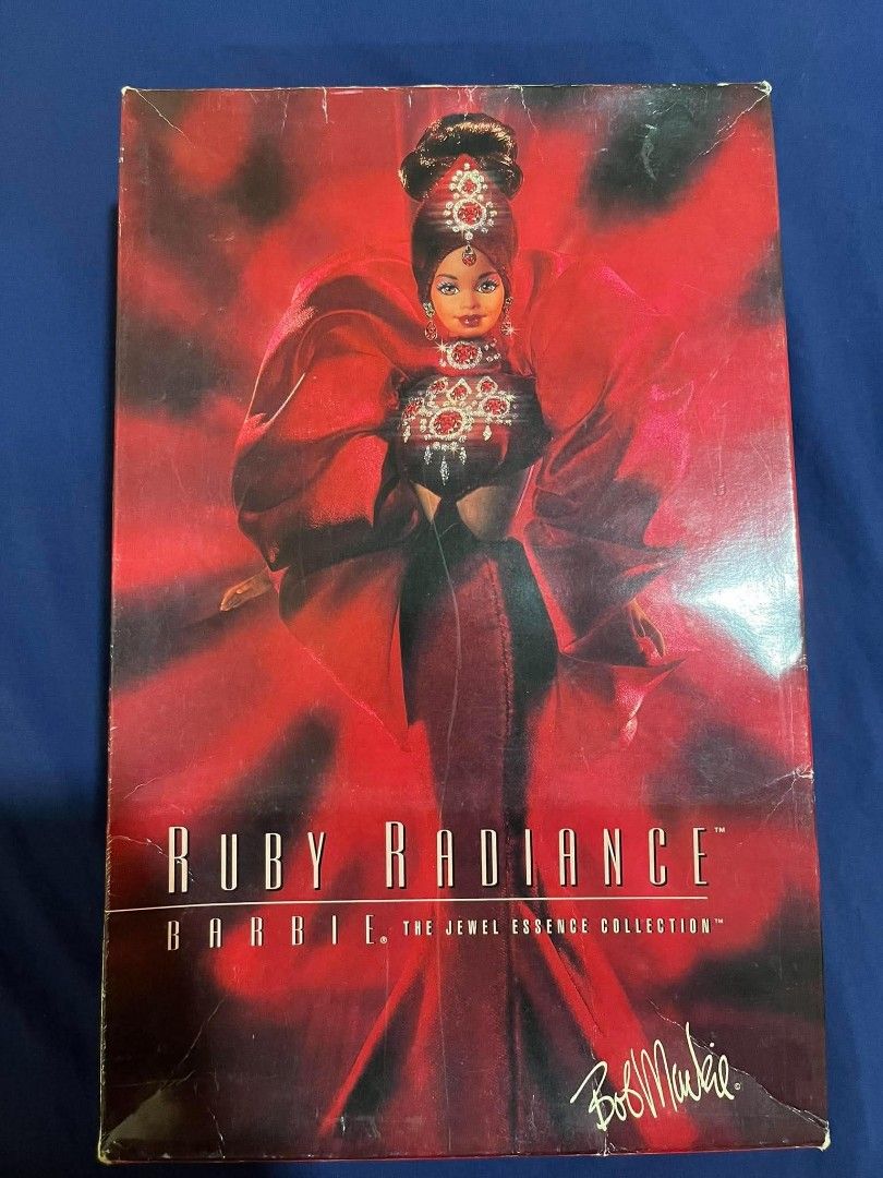 Bob Mackie Jewel Essence Collection Ruby Radiance (Category: Vintage Collectibles) located in Mangatarem. Submitted by lorenzrillon517 (Listing ID 1464123909, Image 1). Description: Back in box. Box not in mint condition as well as the cardboard inside. Doll is in great condition and complete with shoes..