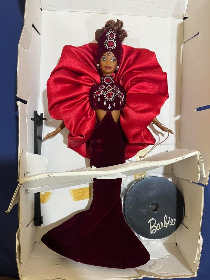 Bob Mackie Jewel Essence Collection Ruby Radiance (Category: Vintage Collectibles) located in Mangatarem. Submitted by lorenzrillon517 (Listing ID 1464123909, Image 2). Description: Back in box. Box not in mint condition as well as the cardboard inside. Doll is in great condition and complete with shoes..