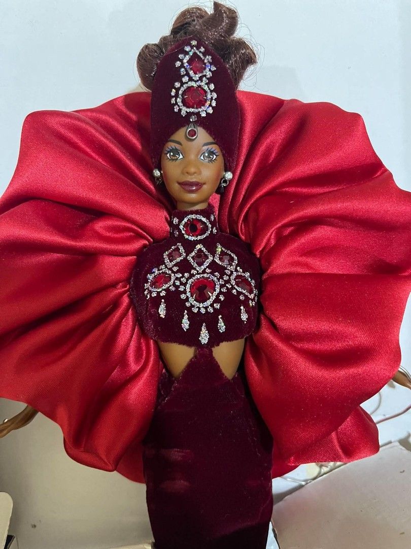 Bob Mackie Jewel Essence Collection Ruby Radiance (Category: Vintage Collectibles) located in Mangatarem. Submitted by lorenzrillon517 (Listing ID 1464123909, Image 3). Description: Back in box. Box not in mint condition as well as the cardboard inside. Doll is in great condition and complete with shoes..