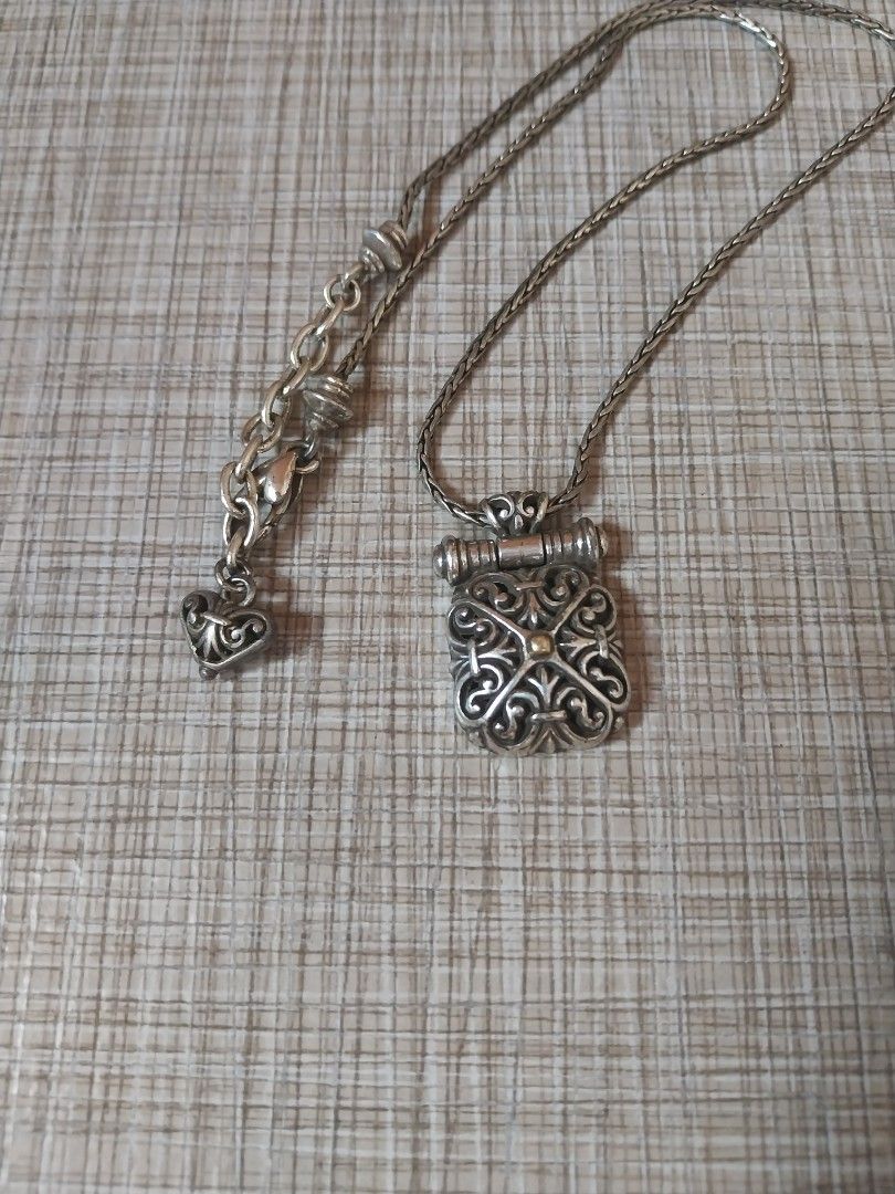 Brighton Silver Scrolled Square Rolled bar Necklace with Original Box (Category: Accessory Holder, Box & Organizers) located in Manila. Submitted by j.dlh (Listing ID 1463987772, Image 2). Description: - Silver-tone chain necklace with decorative pendant -Heart-shaped tin case from Brighton - Features a black and white damask pattern - Quote from Brighton on the inside lid -Original brighton from USA.