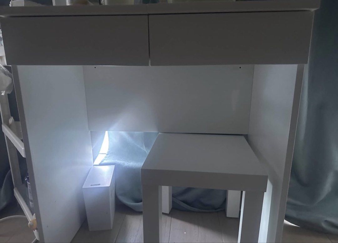 BRIMNES Dressing Table White 70x42 cm (Category: Tables & Sets) located in Manila. Submitted by whodatboii (Listing ID 1464137343, Image 2). Description: - IKEA white dressing table - Features a flip-top mirror with built-in storage compartments - Includes two spacious drawers - Compact dimensions: 70x42 cm - Ideal for organizing makeup, skincare, and accessories - Stool is included - Selling in its current condition (as is).