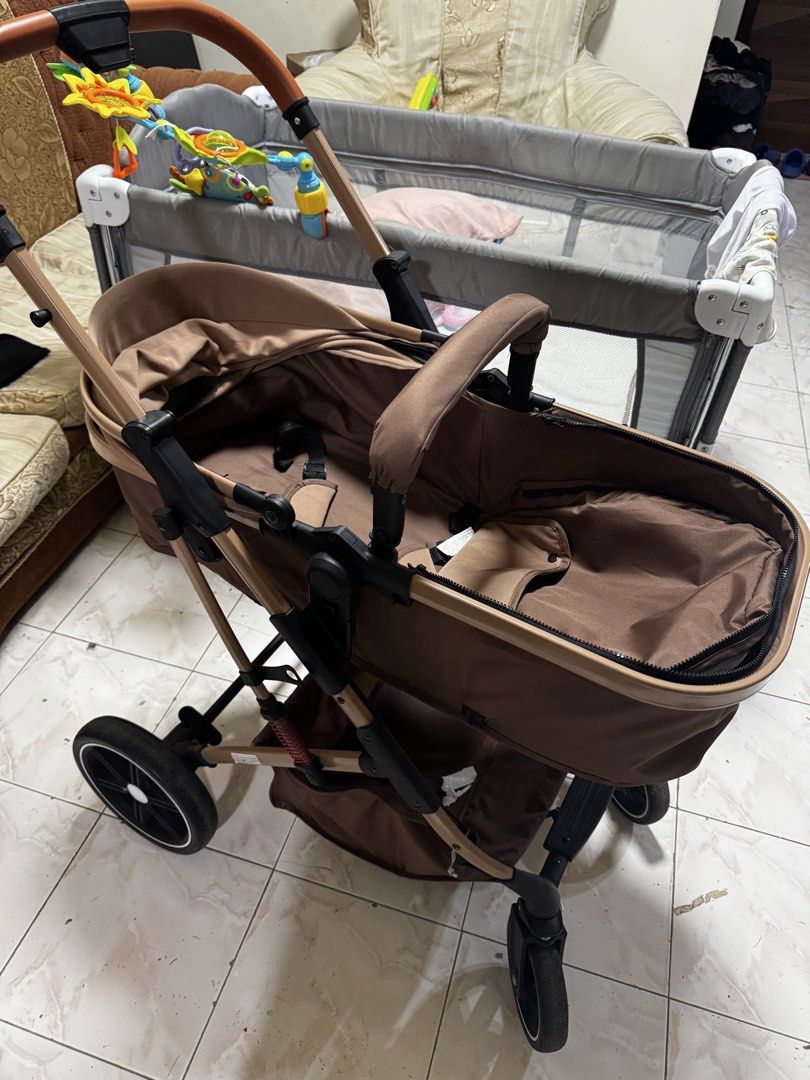 Brown Baby Stroller with Adjustable Handle (Category: Strollers) located in Penaranda. Submitted by deardarlaph_ (Listing ID 1464051251, Image 2). Description: - Brown baby stroller - Reversible seat for facing parent or world - Adjustable handle for comfortable pushing - Canopy offers sun protection - Convenient storage basket underneath - Swivel wheels for easy maneuverability - Folds compactly for storage and travel - Ideal for daily walks and