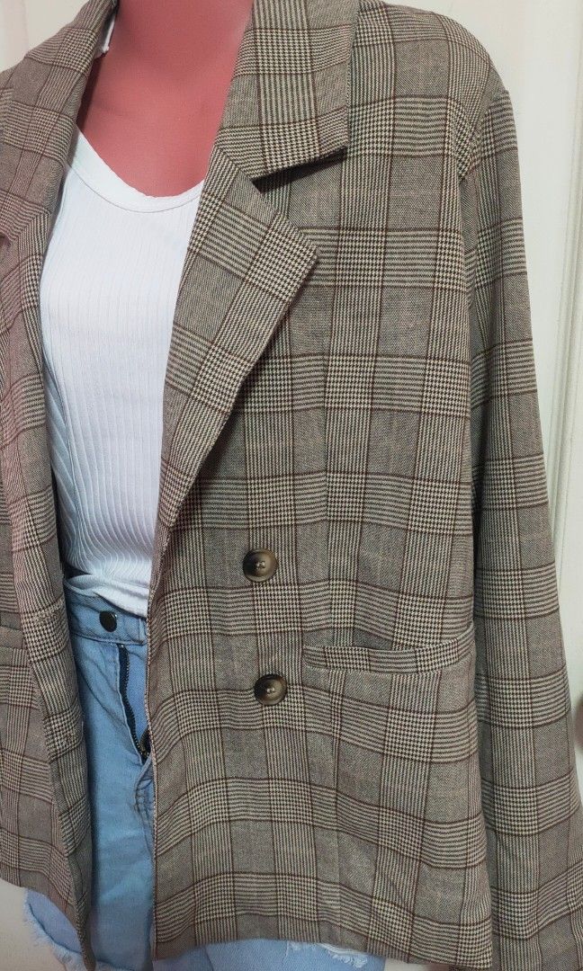 Brown Plaid Double-Breasted Blazer (Category: Coats, Jackets and Outerwear) located in Antipolo. Submitted by strawberricae (Listing ID 1464056886, Image 3). Description: - Brown plaid double-breasted blazer - Features two front pockets - Versatile for casual and smart-casual styling - Looks great layered over a white top and denim shorts.