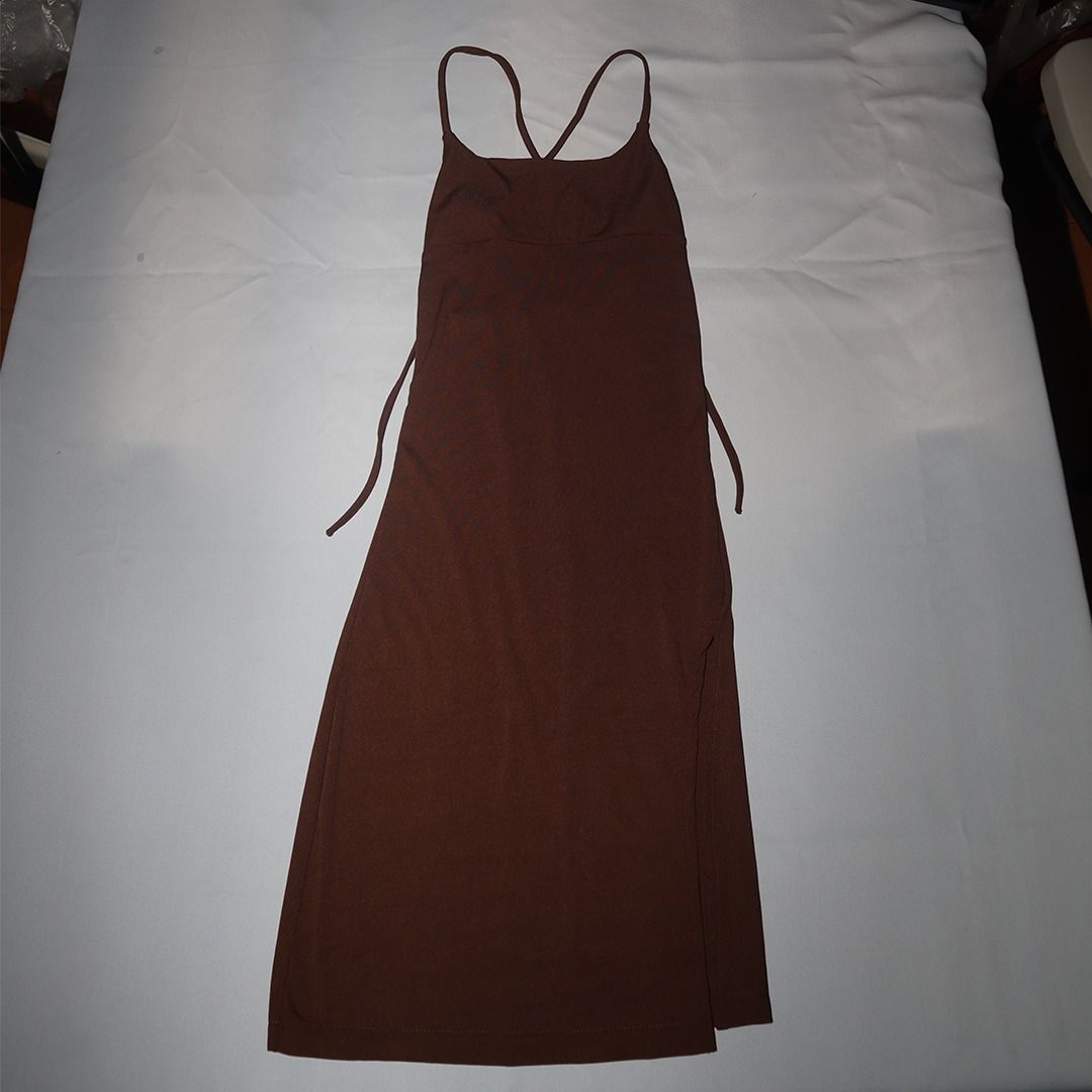 Brown Spaghetti Strap Maxi Dress with Side Slit (Category: Dresses) located in Tanauan. Submitted by arlene_panganiban (Listing ID 1463985974, Image 2). Description: - Comfortable and flowy brown maxi dress - Features spaghetti straps - Chic criss-cross back detail - Adjustable tie sides for a custom fit - High slit on the side for added flair - Ideal for casual days or beach getaways.