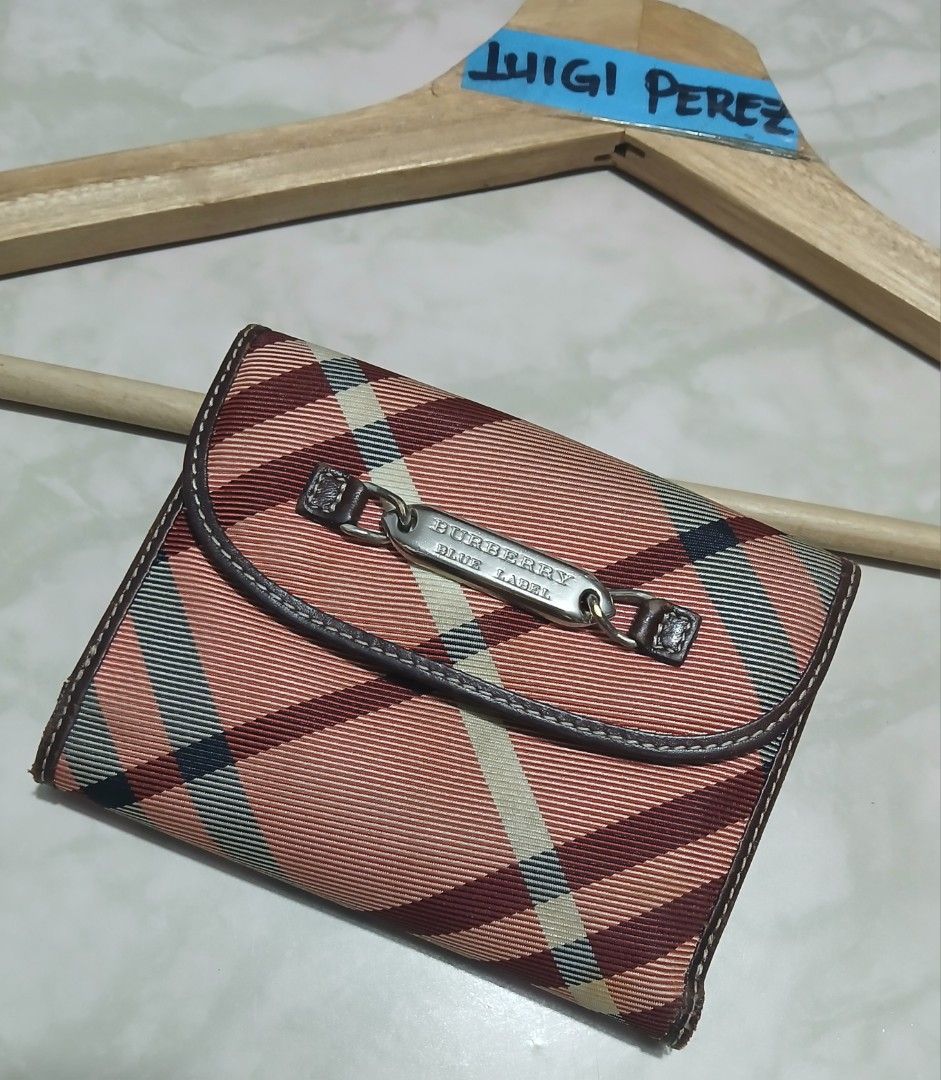 Burberry Blue Label Plaid Wallet (Category: Luxury Bags & Wallets) located in Plaridel. Submitted by igieperez147282 (Listing ID 1464005443, Image 1). Description: - Burberry Blue Label wallet - Classic pink and brown plaid pattern - Genuine leather trim - Secure snap closure - Ample interior card slots and compartments - Stylish and practical for daily use.
