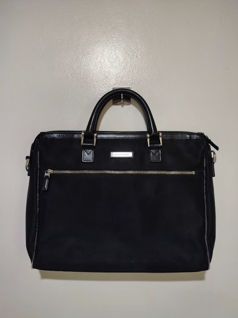 Burberry Briefcase Handbag (Category: Luxury Bags & Wallets) located in Mangaldan. Submitted by thrift.mo.ba (Listing ID 1463968691, Image 1). Description: Burberry Briefcase Handbag no sling with flaws.