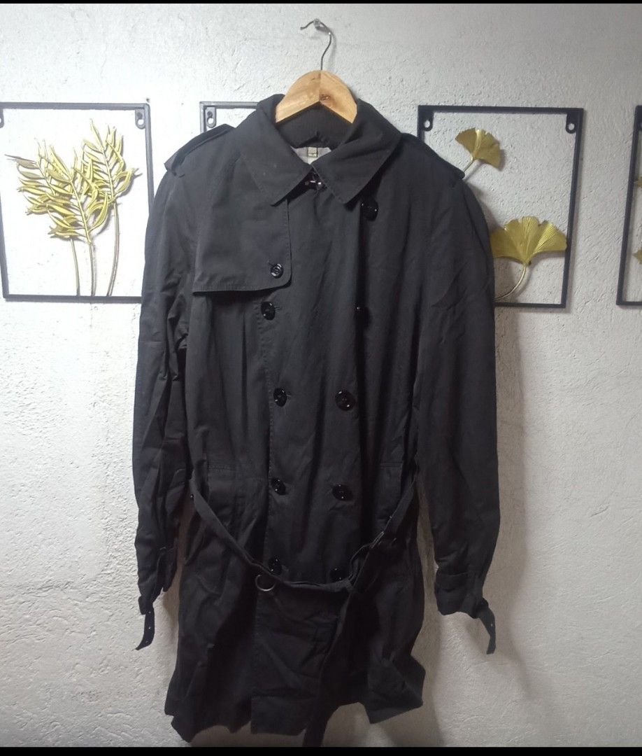 Burberry Double Breasted Trench Coat Size M (Category: Coats, Jackets and Outerwear) located in Kawit. Submitted by deidzdzn (Listing ID 1460205865, Image 2). Description: - Classic Burberry trench coat - Color: Dark Gray - Style: Double-breasted - Features: Belted waist with buckle - Size: M - Measurements: Width 21 inches, Length 37 inches - Interior: Iconic Burberry check lining - Perfect for layering.