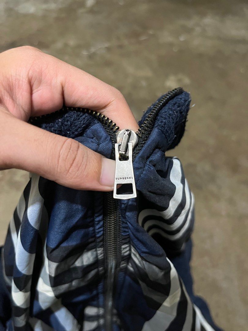 Burberry London Plaid Zip-Up Jacket (Category: Coats, Jackets and Outerwear) located in Caloocan City. Submitted by pumarenluc79160 (Listing ID 1464068625, Image 3). Description: - Authentic Burberry London Jacket - Iconic Navy Blue Plaid Pattern (White & Light Blue Checks) - Full Zip Closure - Ribbed Cuffs and Hem - Premium Riri Zipper - Excellent addition to any collection.