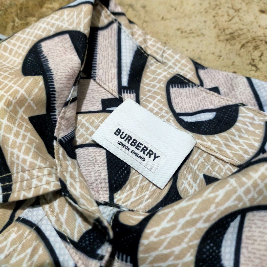 Burberry Monogram Print blouse (Category: Longsleeves) located in Zamboanga. Submitted by _oliverbmth (Listing ID 1464074859, Image 2). Description: - Iconic Burberry monogram print - Long sleeves - Button-up style - Material: 100% Polyester - Size: 36 - Made in China - Perfect for a statement look - Dimes 20x27.