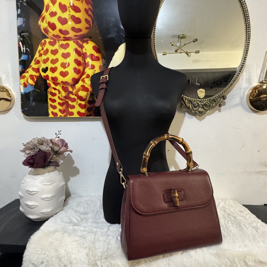 Fusella top handle bamboo 2way bag (Category: Tote Bags) located in Rizal. Submitted by houseofbell (Listing ID 1464113685, Image 2). Description: - Elegant burgundy genuine leather handbag - Features a stylish bamboo top handle - detachable shoulder strap for versatility - Bamboo detail on the closure adds a unique touch Dimension: 10.5x8.5 inches Made in italy.