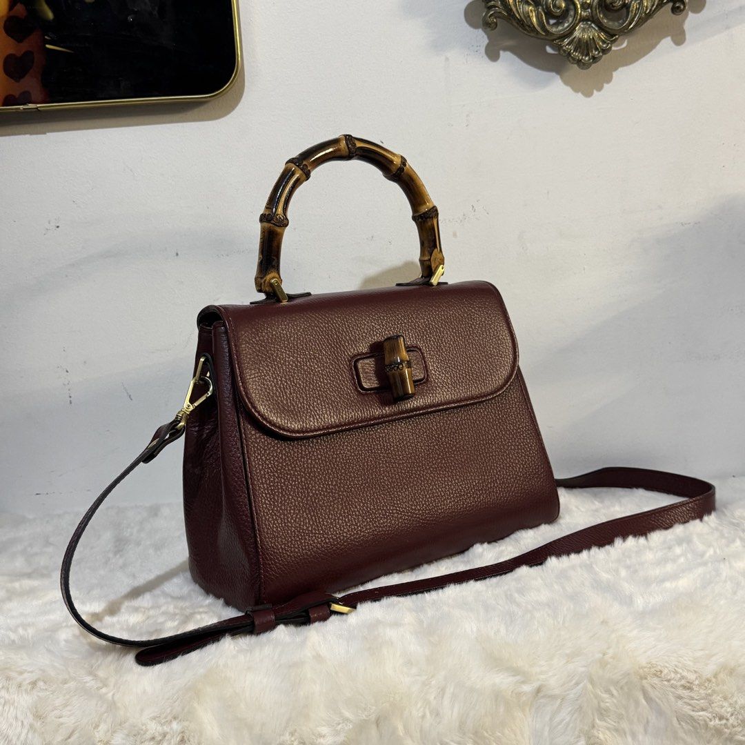 Fusella top handle bamboo 2way bag (Category: Tote Bags) located in Rizal. Submitted by houseofbell (Listing ID 1464113685, Image 3). Description: - Elegant burgundy genuine leather handbag - Features a stylish bamboo top handle - detachable shoulder strap for versatility - Bamboo detail on the closure adds a unique touch Dimension: 10.5x8.5 inches Made in italy.