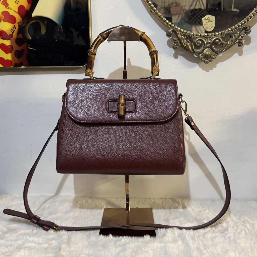 Fusella top handle bamboo 2way bag (Category: Tote Bags) located in Rizal. Submitted by houseofbell (Listing ID 1464113685, Image 1). Description: - Elegant burgundy genuine leather handbag - Features a stylish bamboo top handle - detachable shoulder strap for versatility - Bamboo detail on the closure adds a unique touch Dimension: 10.5x8.5 inches Made in italy.