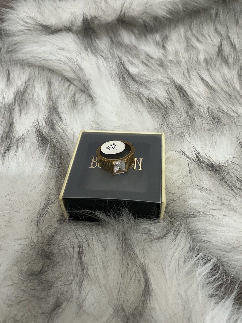 BURVON Clash Collection Ring in Zoi (Category: Rings) located in Manila. Submitted by francine.edit (Listing ID 1464010836, Image 2). Description: Description: Selling my brand new Burvon Zoi Ring from The Classic Collection. Completely unused and still comes with its original box! Brand / Collection: Burvon - The Classic Collection Model / Style: Zoi Ring (Gold ribbed band with emerald-cut clear stone) Size: 7 Condition: Brand New / Unused (Incl