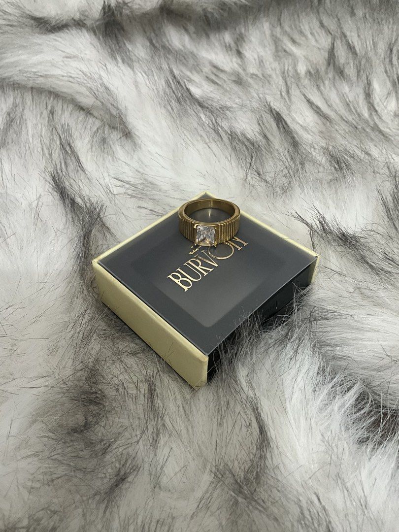 BURVON Clash Collection Ring in Zoi (Category: Rings) located in Manila. Submitted by francine.edit (Listing ID 1464010836, Image 3). Description: Description: Selling my brand new Burvon Zoi Ring from The Classic Collection. Completely unused and still comes with its original box! Brand / Collection: Burvon - The Classic Collection Model / Style: Zoi Ring (Gold ribbed band with emerald-cut clear stone) Size: 7 Condition: Brand New / Unused (Incl