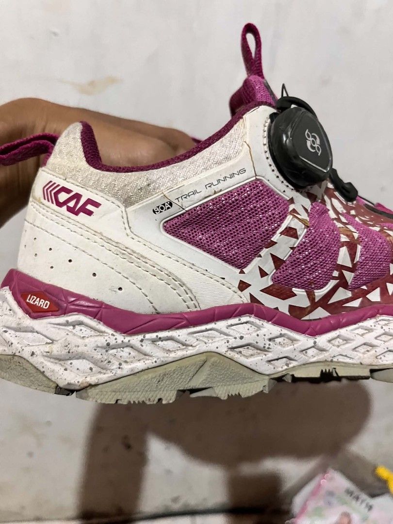 CAF Trail Running Shoes BOA Dial System Pink (Category: Sneakers) located in Jagna. Submitted by calmturtle_46c083 (Listing ID 1464069724, Image 3). Description: - Pink trail running shoes - Easy BOA dial system for quick tightening - Stylish white and pink geometric pattern on the side - Speckled sole design - Made in Vietnam - Ideal for outdoor adventures and trail running.
