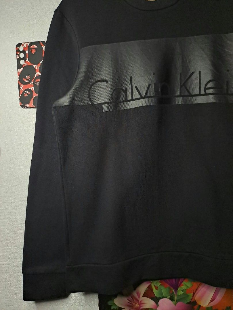 Calvin Klein Large Logo (Category: Coats, Jackets and Outerwear) located in Quezon City. Submitted by yaseen73 (Listing ID 1464112610, Image 3). Description: Calvin Klein Large Logo in Black Wearing Size : Medium Dimensions : Please Refer to the Photo No Issue Nearly New Condition Pre - Owned Courier : J&T Lalamove MOP : G C A S H B A N K T R A N S F E R Seller's Location : 📍Brgy. Pansol, Q.C.
