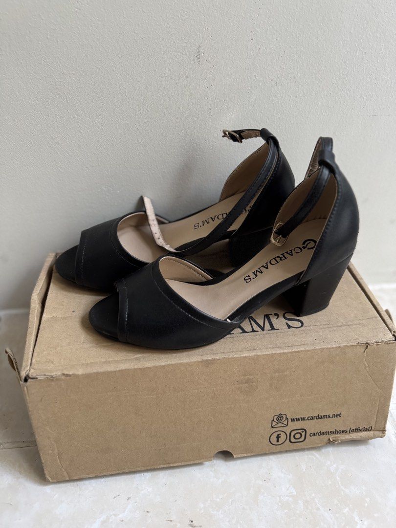 Cardam's Black Peep-Toe Ankle Strap Heels (Category: Heels) located in Cavite. Submitted by araja____7 (Listing ID 1463973512, Image 3). Description: - Brand: Cardam's - Style: Black peep-toe heels - Features: Ankle strap with buckle closure, comfortable block heel - Versatile: Perfect for dressing up or down - Condition: Comes with original box.