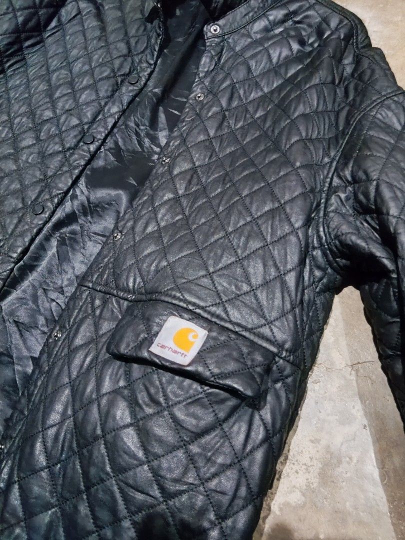 Carhartt Quilted Black Jacket L (Category: Coats, Jackets and Outerwear) located in Angeles City. Submitted by ramosjarie87785 (Listing ID 1464080834, Image 3). Description: - Brand: Carhartt - Type: Quilted Jacket - Color: Black - Size: L - Closure: Button-up - Pockets: Two front pockets - Lining: Smooth and shiny - Condition: Minor tear on the right sleeve (see last photo) - Style: Great for layering.