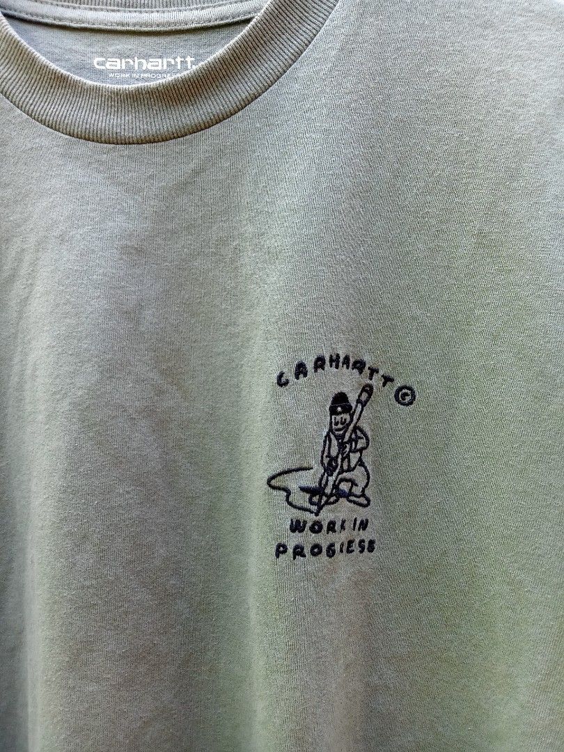 Carhartt Work In Progress T-Shirt Size M (Category: Tshirts & Polo Shirts ) located in Sipocot. Submitted by danthrift122218 (Listing ID 1463956343, Image 3). Description: - Carhartt WIP T-shirt - Color: Olive Green - Graphic: 'Work In Progress' on chest - Material: 100% Organic Cotton - Size: Medium - Ideal for: Casual wear.