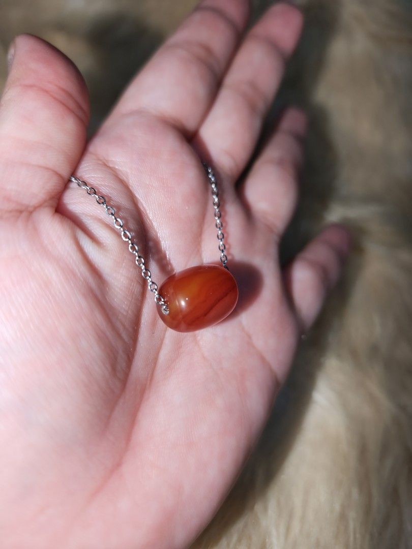 Carnelian Barrel Pendant (Category: Necklaces) located in Quezon City. Submitted by piaoliangcollections.ph (Listing ID 1463950013, Image 3). Description: Carnelian is a fiery orange-to-red gemstone believed in crystal traditions to boost motivation, courage, and creative energy. Mental and Emotional Benefits Motivation and Drive: Known as the "artist's stone," it helps overcome procrastination, apathy, and self-doubt. Confidence: It is thought t