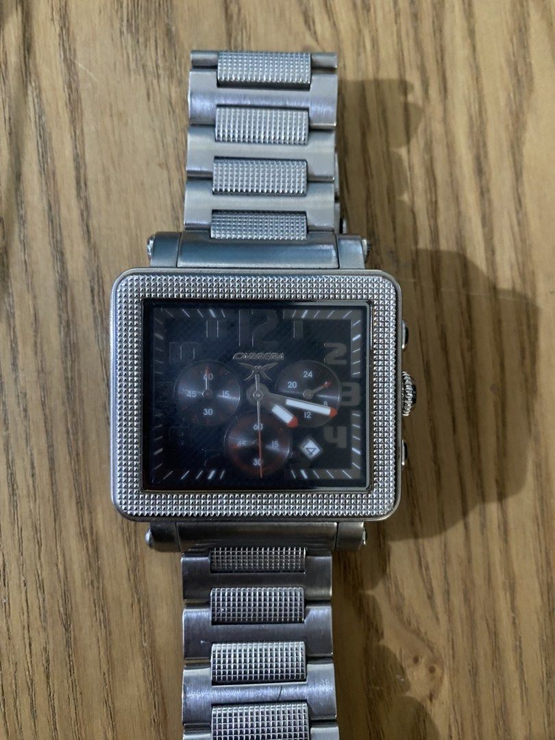 Carrera Square Chronograph Watch (Category: Luxury Watches) located in Mandaluyong City. Submitted by janleevee (Listing ID 1463956727, Image 3). Description: - Silver-tone Carrera watch - Square face with black dial - Features chronograph subdials - Stainless steel band with textured links - Crown and pushers on the side - 'All Stainless Steel' and 'Water Resistant' marked on the back - Model number visible on the back.