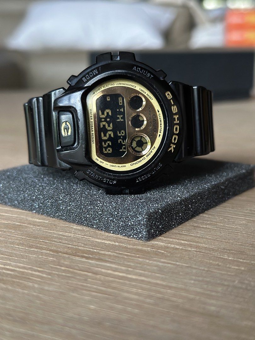 Casio G-Shock DW-6900CB Watch (Category: Men's Watches) located in Cainta. Submitted by the_lawww (Listing ID 1463993878, Image 2). Description: - Model: G-Shock DW-6900CB - Color: Black with Gold Face - Water Resistance: 200 Meters - Features: Shock Absorbing Structure - Ideal for: Everyday wear, sports, outdoor activities - Condition: Selling as is -Newly replaced battery ₱2,500 For meetups and delivery Antipolo, Taytay, Cainta, Pasig, Makati, 