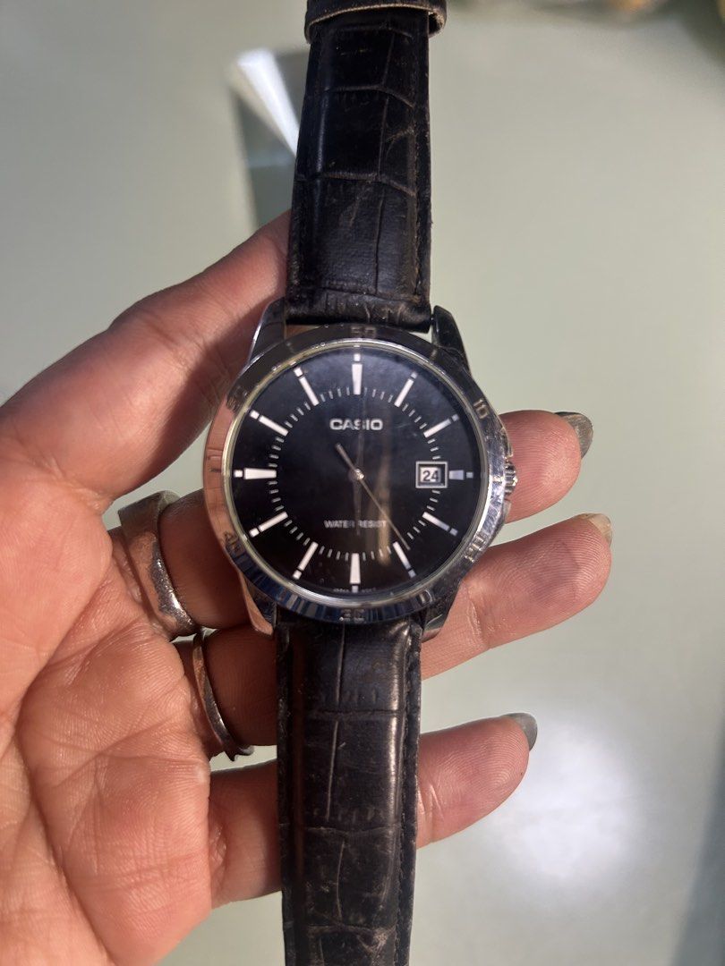 Casio Water Resist Black Dial Watch (Category: Men's Watches) located in Cavite. Submitted by mamamia73 (Listing ID 1464037888, Image 1). Description: - Casio watch with a classic black dial - Convenient date window at 3 o'clock - Water resistant for everyday peace of mind - Comfortable black leather strap - Versatile 40mm watch face size - Ideal for daily wear.