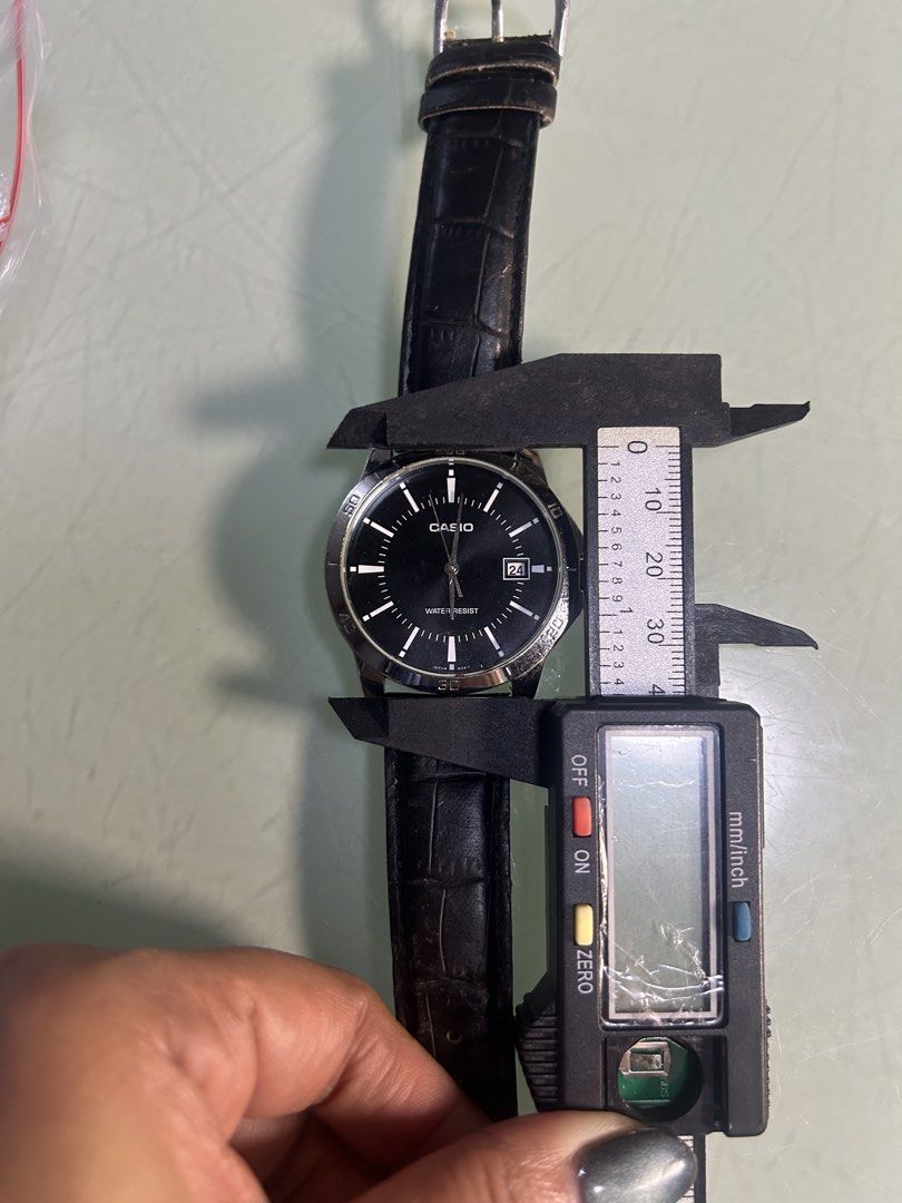 Casio Water Resist Black Dial Watch (Category: Men's Watches) located in Cavite. Submitted by mamamia73 (Listing ID 1464037888, Image 2). Description: - Casio watch with a classic black dial - Convenient date window at 3 o'clock - Water resistant for everyday peace of mind - Comfortable black leather strap - Versatile 40mm watch face size - Ideal for daily wear.