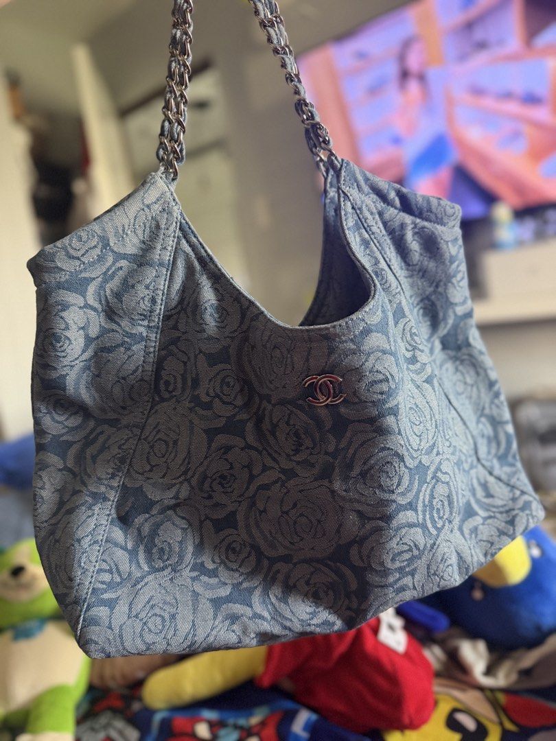 CC Denim Rose Print Hobo Bag (Category: Shoulder Bags) located in Pasig City. Submitted by glamomma (Listing ID 1463940454, Image 2). Description: - Stylish denim hobo bag - Features a lovely rose print - Comfortable chain and leather strap - Ideal for everyday use - Spacious interior for all your essentials - in excellent preloved like new condition .