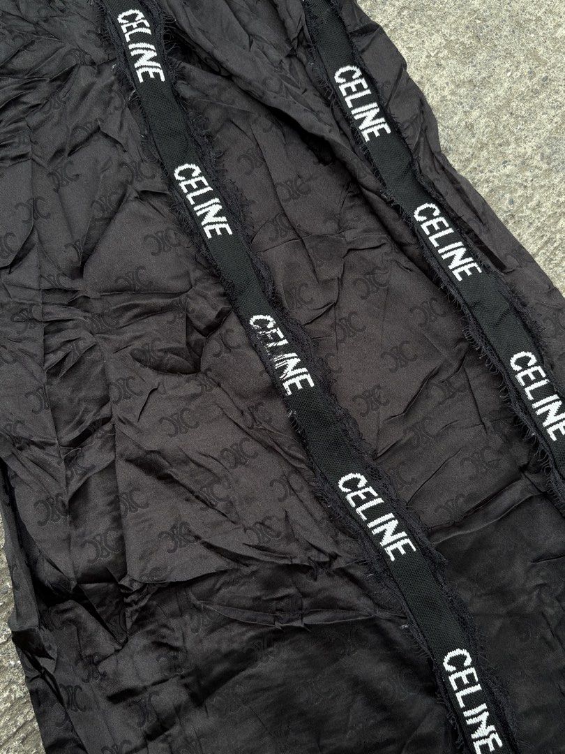CELINE Black Monogram Track Pants Size L (Category: Other Bottoms) located in Iligan City. Submitted by seddicmoti2002 (Listing ID 1463982940, Image 3). Description: - Brand: CELINE -Wide leg - Stretchable - Color: Black - Design: All-over monogram pattern - Features: CELINE branded tape down the sides, elastic waistband - Material: 100% Nylon - Size: L (fits 165/88A).