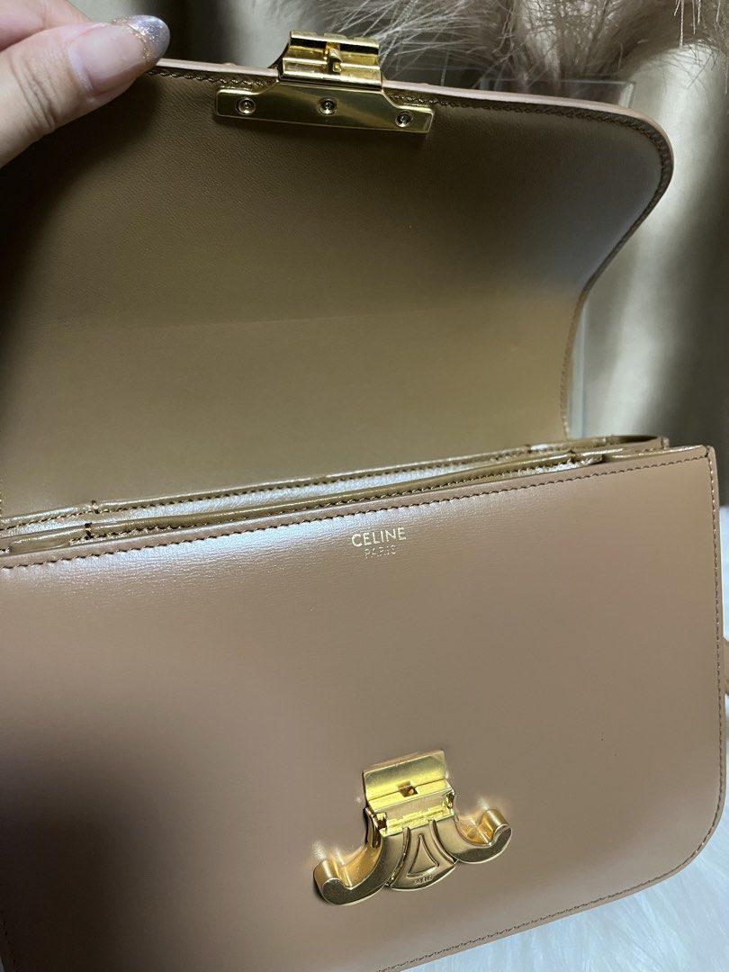 Celine Triomphe Bag Tan Leather Gold Hardware (Category: Luxury Bags & Wallets) located in Pasay City. Submitted by 2ndloveforever2023 (Listing ID 1464076234, Image 3). Description: - Japan Sourced - Iconic gold Triomphe clasp - Multiple interior compartments - Interior zip pocket - coded - Adjustable strap - Clean inside and out - Comes with original dust bag.