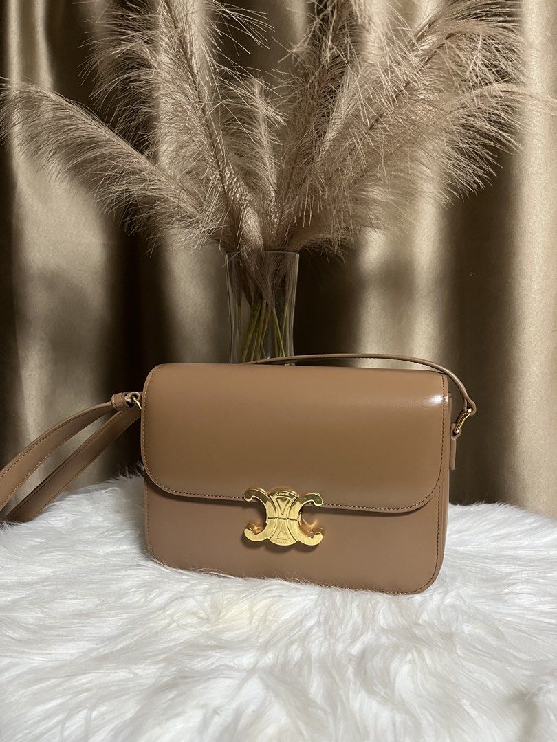 Celine Triomphe Bag Tan Leather Gold Hardware (Category: Luxury Bags & Wallets) located in Pasay City. Submitted by 2ndloveforever2023 (Listing ID 1464076234, Image 1). Description: - Japan Sourced - Iconic gold Triomphe clasp - Multiple interior compartments - Interior zip pocket - coded - Adjustable strap - Clean inside and out - Comes with original dust bag.