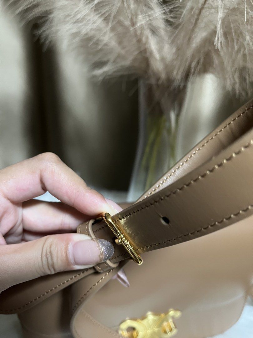 Celine Triomphe Bag Tan Leather Gold Hardware (Category: Luxury Bags & Wallets) located in Pasay City. Submitted by 2ndloveforever2023 (Listing ID 1464076234, Image 2). Description: - Japan Sourced - Iconic gold Triomphe clasp - Multiple interior compartments - Interior zip pocket - coded - Adjustable strap - Clean inside and out - Comes with original dust bag.