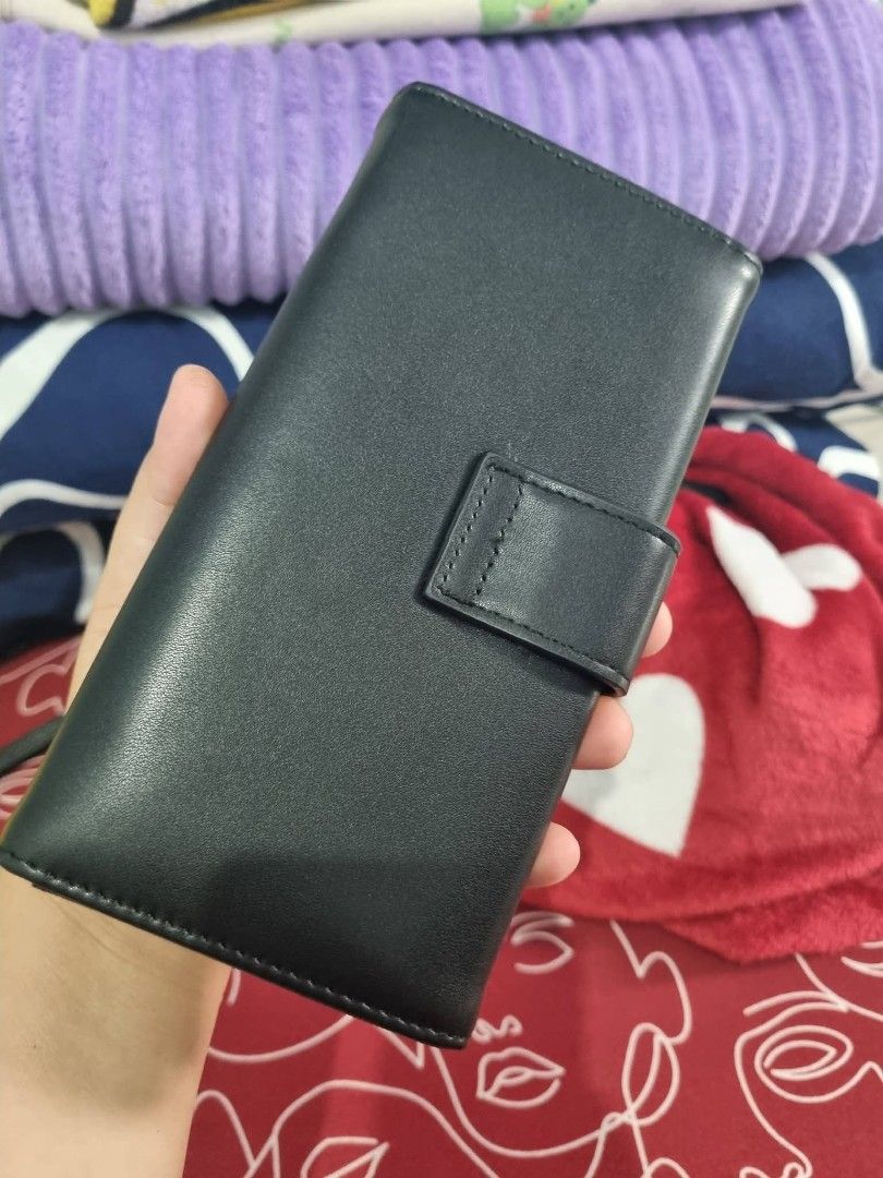 Celine Triomphe Wallet Black Leather (Category: Luxury Bags & Wallets) located in Candon. Submitted by bernabepradoiii (Listing ID 1463939667, Image 3). Description: - Genuine black leather wallet - Iconic Celine Triomphe logo in gold hardware - Secure snap closure - Ample card slots for organization - Interior zip pocket for coins or small items - Stylish and practical for everyday use.