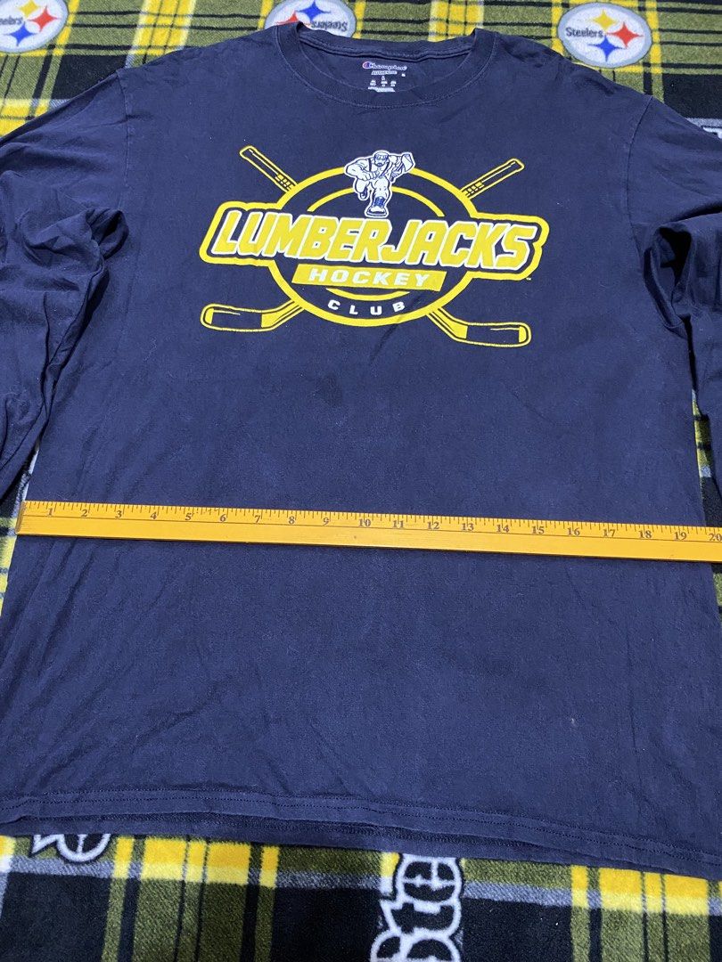 CHAMPION,long sleeve shirt (Category: Coats, Jackets and Outerwear) located in Cavite. Submitted by jc_thrift95 (Listing ID 1464093142, Image 3). Description: - a navy blue Champion long-sleeve t-shirt featuring a prominent yellow Lumberjacks Hockey Club graphic on the chest. - Made in Nicaragua - Color rate 8/10 - See pictures details for dimes..